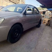 لانسر للبيع موديل 2009 رقم انكليزي بسمي داخله هزه  بيه جملغات الاماميه...