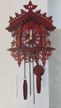 ساعة • وقواق • خشب