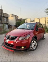 ‏سوزوكي SX4 موديل 2014 ياباني 🇯🇵اصلي ( خليجي )‏ لون احمر🍅 .. رقم بغداد...