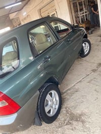 كيا سبورتج موديل 2008مصبوغه حزام المكينه بيها خيط بخار معروضه على 73وب...