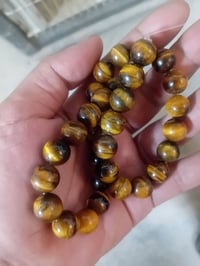 عين النمر طبيعي • خرز ٤–١٦مم • تأثير عين القط