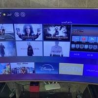 تلفزيون جينرال 4K • ٦٥ بوصة • ميز تلفزيون زجاجي