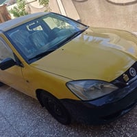 لانسر ٢٠١٠ دوشمه جديده منظومة تبريد جديده صدر خلفي جديد مكينه وكير خير...