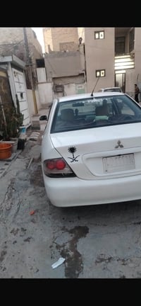 لانسر للبيع موديل 2010 رقم بغداد محول انكليزي بسمي سابقا صفره تبريد ثل...