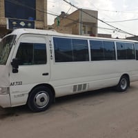عندي كوستر تيوتا للبيع موديل ٢٠٠٢ لون ابيض بلاد مصبوغه عام رقم جديد بغ...