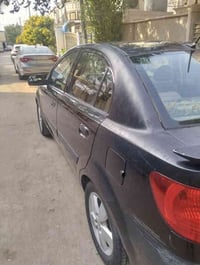 كيا ريو 2009 أمريكي  ضربة جاملغ خلفي ايسر وتبديل قبق جنطة بدون دواخل و...