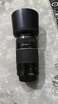 عدسة كانون • ٧٠-٣٠٠ • خلل بسيط