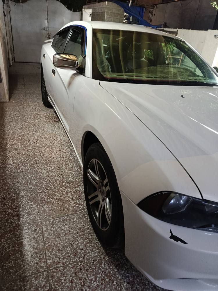 دوج جارجر موديل 2013 خليجيه بدون صبغ فول عده الفتحه شاشه جبيره كير طياره داخل عسلي بصمه السياره جديده سعرها 170 بيع او امراوس تلفون *********** بغداد, العراق
