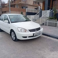 لانسر ٢٠١٣ • قير اوتوماتيك • ١٥٤٠٠٠ كم