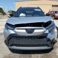 تويوتا كورلا كروس SE  هايبرد  7MUFBABG1RV033268  2.0L 4   مكينه وارد ا...