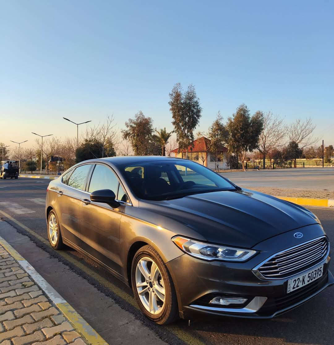 فورد فيوجن 2018 – SE
📄 ضرر خفيف جداً + اغراضها كلها بلادي

# السيارة ماشية 86،000 الف كيلومتر

🔧 المحرك والقير

 • محرك 1.5 EcoBoost توربو

 • ناقل حركة ماوس أوتوماتيك

 • دفع أمامي

 • اقتصادي ونشيط جداً

✨ مواصفات SE
• تبريد قطعتين 

 • كشنات قماش اسود

 • تدفئة كشنات

• كشن السائق والراكب كهربائي

 • تشغيل عن بُعد

 • Apple CarPlay / Android Auto

 • مثبّت سرعه (Cruise Control)

 • شاشة وسطية كبيرة

 • كاميرا خلفية + حساسات رجوع

 • دخول ذكي + بصمة تشغيل 

• رمز دخول في الباب

 • بلوتوث + USB + AUX

 • مقود متعدد الأزرار

🛡️ أمان وتقنيات

 • Airbags كاملة

 • ABS + Traction Control

 • إضاءة LED نهارية

• إشارة تسلسلية

 • Hill Assist

📌 حالة السيارة

 • صيانة دورية

 • محرك وكير بحالة ممتازة

 • استخدام نظيف بدون مشاكل

💵سعر: 130$ وبيها مجال بسيط

📍 ألانبار - الرمادي

📞 للاستفسار

***********
