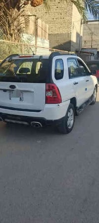 كيا سبورتج موديل 2009خليجي  محرك ألفين المرغوب  ويل كب لون أبيض  رقم ا...