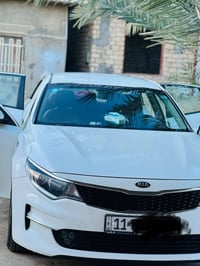 كيا اوبتما خليجي لون ابيض صدفي موديل 2018 ماشيه  110الف رقم بغداد محرك...