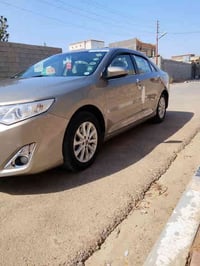 كامري موديل 2013خليجي بيه صبغ ماشر عليه خط احمر باقي مكفول سياره جديده...