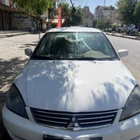 لانسر بومة  موديل ٢٠٠٩ مكينة ٢٠٠٠  تبريد تدفئه خير من الله   الاتصال ٠...