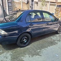 لانسر مصبوغه جماليه ٢٠٠٩مكينه قبق اسود كير اوتو تبريد ثلج تخم تاير جدي...