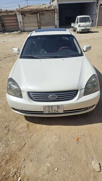 اوبتيما موديل 2008  ابيض  رقم دولي  فتحه بصمه محرك 2000 دوش بلادي شركه...