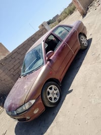 بروتون ٢٠٠٤ • اوتو • ذي قار