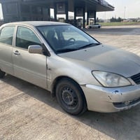 لانسر ٢٠١٠ • اوتوماتيك • بلا خدوش