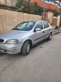 اوبل استرا ٢٠٠٢ محرك ١.٦ مصبوغة حزام اثر جراد . عارضهة ٤٧ . مبايل 0770...