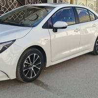 كورلا ٢٥ هايبرد • فتحة سقف • بصمة