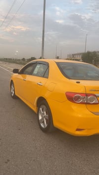 كورولا 2011 • سنوية لحد 2028 • باب قدام متضرر