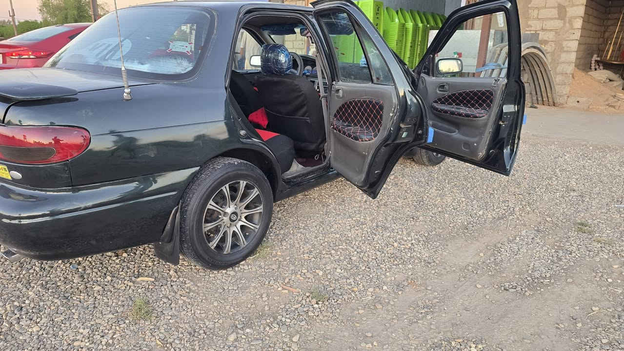 كيه سفيه موديل ٩٥ رقم بغداد مشروع وطني كير اوتوماتيك تبريد ثلج محرك مفتوح مصبوغه عام للجماليه مكفوله من ضربه ولكص تخم تاير حداديه جام كهربيات مسجل كلها شغاله سعر ٣٦ العنوان بابل شوملي الموبايل ***********
