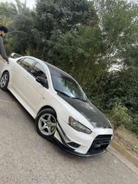 لانسر قرش ٢٠١٥ محرك ٢٠٠٠ وارد امريكي للبيع السعر ٩٨ رقم بغداد باسمي ٠٧...