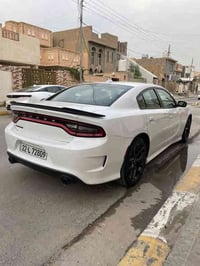 للبيع سيارة جارجر GT بلاد موديل 2021   ماشية 58mi اللون ابيض الرقم أرب...