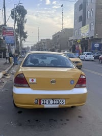 نيسان سني ٢٠١٢ قبغ ابيض  رقم مكرر شبه مميز  بيه طختين  جاملغ خلف السائ...