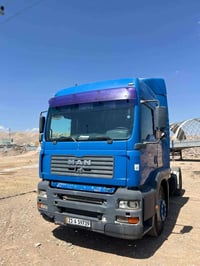 مان 2003 • 410 حصان • جير يدوي`,`كاوتش جديد`,`سطحة`,`ريتایدەر`,`جاهز ل...