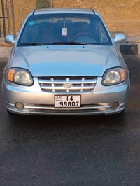 اكسنت • ٢٠٠٣ • بدل باص