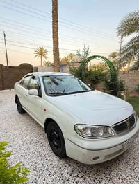 نيسان سني ياباني موديل ٢٠٠٩ محرك اسود  لون ابيض صدفي  تبريد تدفئة ١٠٠٪...
