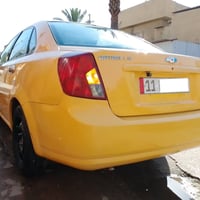 اوبترة 2011 الشركة العامة اصفر سيارة بيها طخات بسيطة  مدوشمة ارضية  كا...