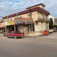 بناية تجارية ركن • ٤٠٠م • ٣شقق ٧محلات