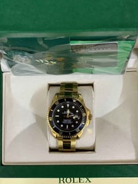 رولكس سبمرينر • ذهب ١٨ • زجاج زفير