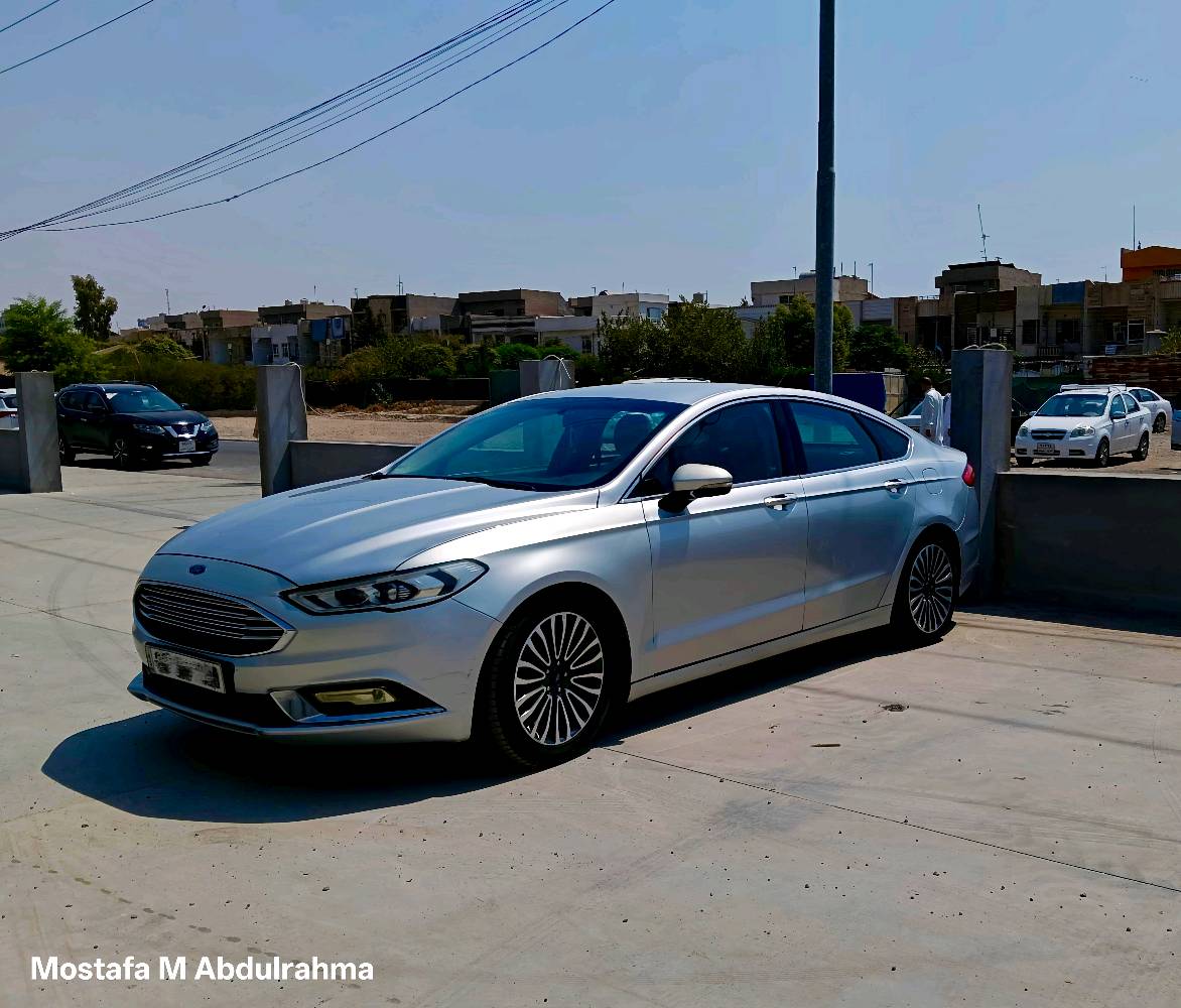 ## 🔥 فورد فيوجن ٢٠١٧ (Ford Fusion 2017) 🔥 سيارة نظيفة جداً، ما شاء الله جاهزة للاستخدام
### 📌 أهم المواصفات والمعلومات:
* **الموديل:** 2017
* **الفئة (المواصفات):** Titanium (فول الفول)
* **المحرك:** 2.0 تيربو (المحرك المرغوب والقوي جداً)
* **ناقل الحركة (الغير):** ماوس (الشكل الجديد)
* **وضعية القيادة:** تحتوي على وضعية **S (Sport)** لقيادة أسرع وأكثر قوة
* **النظام الصوتي:** مجهزة بـ **12 سماعة من براند Sony الشهير** (صوت نقي وقوي جداً خاص بمواصفات التايتانيوم)
* **الشاشة:** شاشة كبيرة أصلية (شاشة لمس مع نظام ذكي)
* **الكراسي:** تدفئة كراسي + كراسي جلد كهربائية
* **الصبغ:** 5 قطع صبغ (بدون أي مشاكل في الدواخل أو الشاصي)
* **مواصفات التايتانيوم الأخرى:**
   * تشغيل بصمة وعن بُعد
   * لايتات أمامية LED مع كشافات ضباب
   * حساسات خلفية مع كاميرا دوارة
   * مرايا جانبية كهربائية مع عدسة
   * ويل كروم كبير ومميز
### 📞 لمعرفة السعر ولمزيد من المعلومات:
يرجى الاتصال على الأرقام التالية أو التواصل عبر **الواتساب**:
👉 ***************
👉 ***************