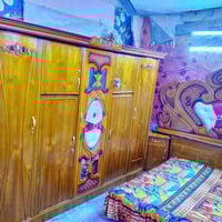 غرفة خشب • خمس أبواب • بغداد