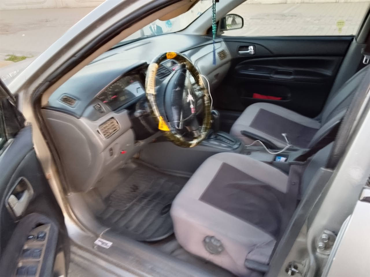 لانسر 2004مصبوغه عام  مكينه تبخر  بكاني بغداد الرقم  ***********موجود واتساب
