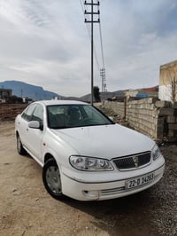 صني 2009 • ابيض • فتيس عادي