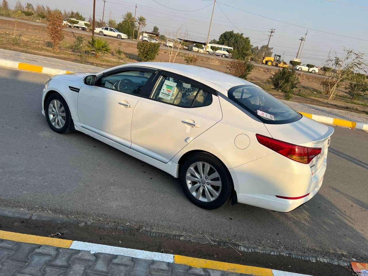 السلام عليكم كيه اوبتيما موديل 2011 خليجيه فول مواصفات ماعدا البنوراما والبصمه السيارة مكفوله من الضربه والتبديل عدا الهلال الخلف صبغ وقبق الصندوگ بس من فوك بي صبغ وباقي السياره مكفوله وجاهزه  من تخم تاير من حداديه مامي خلفي مكينه وكير مكفولات تبريد تدفئه ماناقصها اي شي رقمها أربيل بأسمي مكانها واسط رقم التليفون *********** الرقم الثاني ***********
