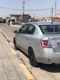 نيسان سنترا موديل 2009رقم بغداد  مثل ما موضح بصوره  الكشر  كدام عينك  ...