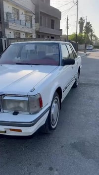 عندي سوبر موديل 85 مكفولة من الضربة بيهة تلث قطع صبغ ابيع احزام  مكينة...