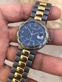 لونجين كوارتز سويسري • قطر ٣٤مم • ذهبي وتيتانيوم