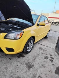 كيا ريو امريكي  موديل ١١ داخل اسود جام كهرب كربون بنزين ضرر قطعه جاملغ...