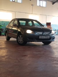 لانسر موديل 2006 رقم بغداد مشروع وطني سنويه٢٨ مكينه وكير مكفولات تخم ت...