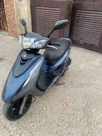 دراجة بريز ببغاء نضيفة مامفتوحة  سرعتها 140مكان الدراجة بغداد حي اور  ...