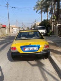 لانسر للبيع موديل 2010 الشركه العامه كير عادي هيئه وغرامات مصفره الجام...