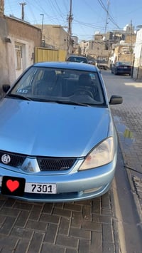 شباب سياره لانسر 2005 مصبوغه عام جماليه ضربته جاملغ خلف الصدر بدون دوا...