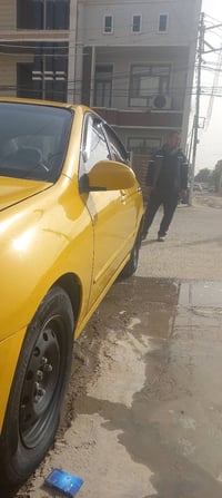 للبيع كيا سبكترا وارد امريكي مكينه بيها خيط خفيف كير و صدر و تبريد خير...